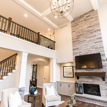 Living Room Remodel Featuring a Ledgestone Fireplace + Cabinetry + Shaw Coretec