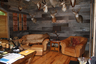 Home office - large rustic freestanding desk light wood floor home office idea in Other with gray walls