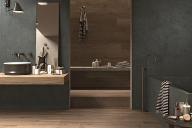 This is an example of a contemporary bathroom in Perth with flat-panel cabinets, medium wood cabinets, an open shower, gray tile, porcelain tile, grey walls, porcelain floors, a vessel sink, tile benchtops and an open shower.