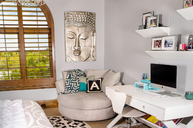 Mid-sized minimalist girl carpeted kids' room photo in Denver with gray walls