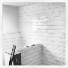 Love the beveled subway tile for showers