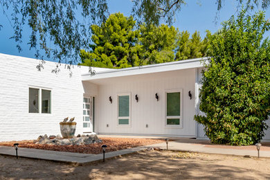 Mid-sized 1950s white one-story exterior home photo in Phoenix with a white roof