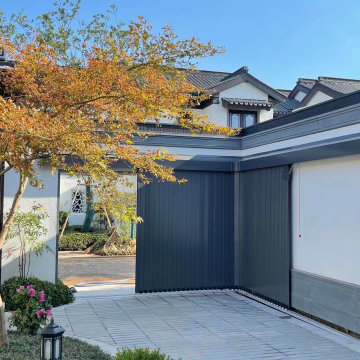 Side sliding automatic garage door for garages with no ceiling space.