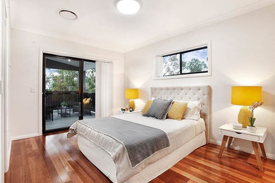 Design ideas for a mid-sized contemporary bedroom in Sydney with white walls.