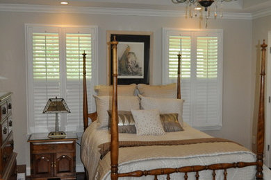 Inspiration for a mid-sized timeless master dark wood floor bedroom remodel in Other with beige walls and no fireplace