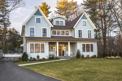 Inspiration for a mid-sized traditional grey exterior in Boston with wood siding and a gable roof.