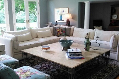 Example of a large classic open concept and formal medium tone wood floor and brown floor living room design in Detroit with blue walls