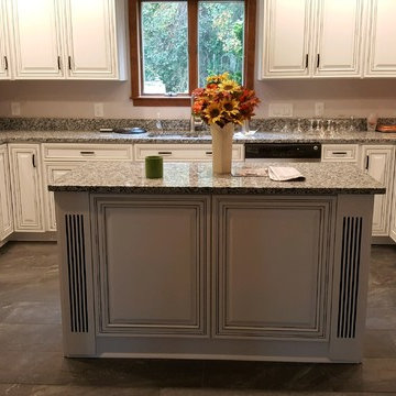 kitchen remodel--white with black glaze cabinets, granite countertop, porcelain