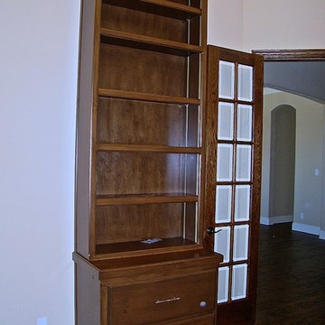 Stained maple bookcase on lateral file.