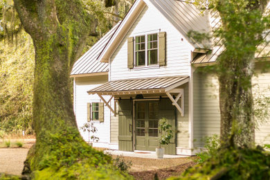 Example of a farmhouse exterior home design in Atlanta