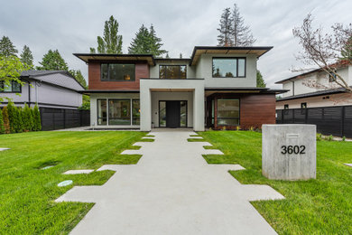 Example of a large trendy home design design in Vancouver
