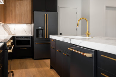 Kitchen - contemporary kitchen idea in Atlanta with quartz countertops, an island and white countertops