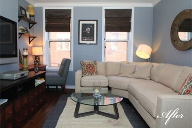 Example of a small transitional enclosed medium tone wood floor living room design in New York with gray walls, no fireplace and a wall-mounted tv