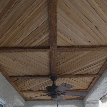 Covered Patio with Faux Wood Beam and Plank Ceiling