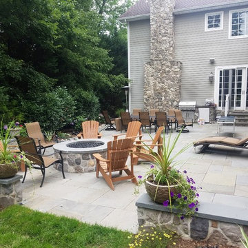 Patio with stone wall and fire pit