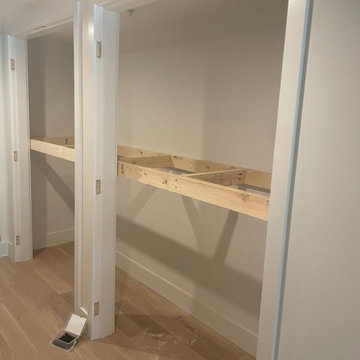Custom shelving and hidden door