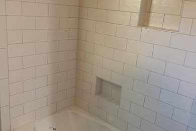 Example of a mid-sized kids' white tile and ceramic tile ceramic tile and multicolored floor bathroom design in Houston