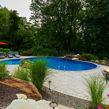 Vinyl pool with Waterfall, Landscape Lighting and Landscaping