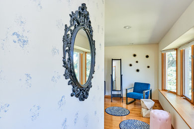 Example of a mid-sized minimalist hallway design in Chicago with gray walls