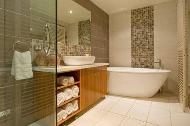 Inspiration for a mid-sized contemporary master brown tile and porcelain tile porcelain tile and brown floor bathroom remodel in Seattle with furniture-like cabinets, black cabinets, a one-piece toilet, white walls, an undermount sink and concrete countertops