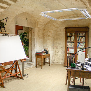 Photo of a mediterranean home studio in Bari with a freestanding desk.