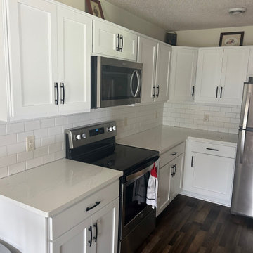 Kitchen Remodel with White Refaced Cabinets and Quartz Tops