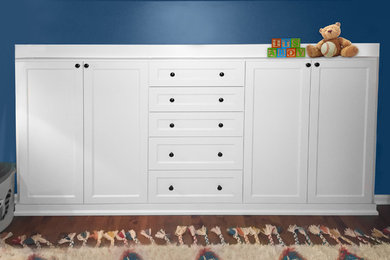 Inspiration for a mid-sized transitional boy dark wood floor nursery remodel in Chicago with blue walls