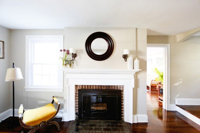 Mid-sized elegant enclosed dark wood floor living room photo in Baltimore with beige walls, a standard fireplace, a brick fireplace and no tv