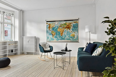 Inspiration for a mid-sized scandinavian open concept living room in Copenhagen with white walls, light hardwood floors, no tv and beige floor.