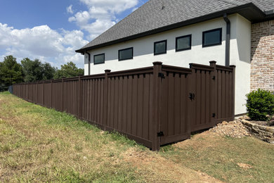 Dark Brown Composite Trex Fence and Black Iron Fence