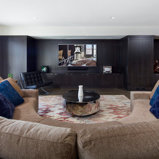 Photo of a large modern walk-out basement with white walls, limestone flooring and a ribbon fireplace.