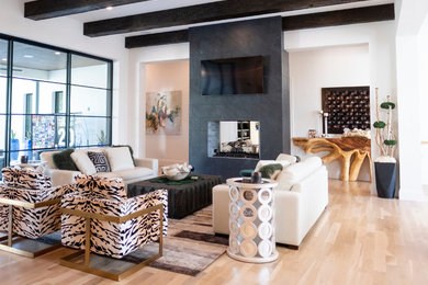 Inspiration for a large contemporary open concept light wood floor and beige floor living room remodel in Dallas with white walls, a two-sided fireplace, a tile fireplace and a wall-mounted tv