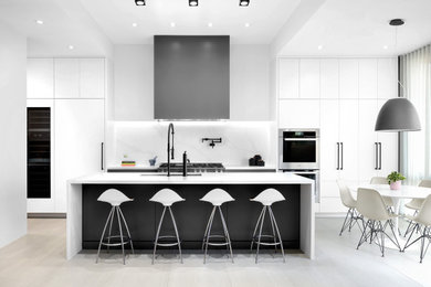 Design ideas for a contemporary kitchen in Toronto with an undermount sink, flat-panel cabinets, white cabinets, quartz benchtops, white splashback, stone slab splashback, panelled appliances, porcelain floors, grey floor and white benchtop.