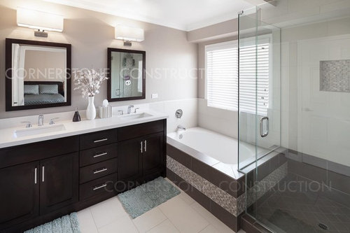 Bathroom vanity next to bathtub