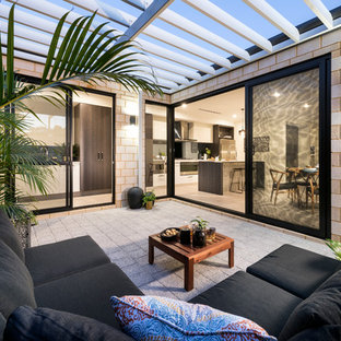 Design ideas for a contemporary patio in Perth with concrete pavers and a pergola.