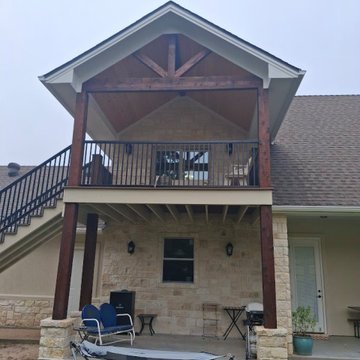 Two-Story Covered Patio & Balcony Addition with Timber Truss Gable