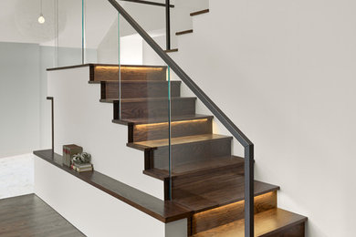 Trendy wooden u-shaped staircase photo in San Francisco with wooden risers