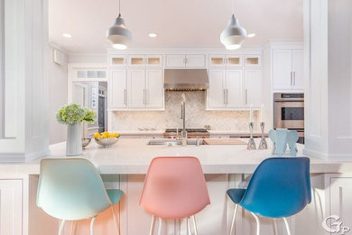 Example of a danish u-shaped dark wood floor and brown floor open concept kitchen design in Boston with a single-bowl sink, beaded inset cabinets, gray cabinets, quartz countertops, gray backsplash, marble backsplash, stainless steel appliances, an island and gray countertops