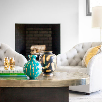 Colorful pottery and a metallic table top give the space life
