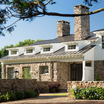 American Farmhouse with Board and Batten and Rustic Stone