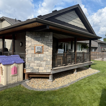 Custom Cedar Covered Deck with Built-In Stone Fireplace and Patio — Sioux Falls