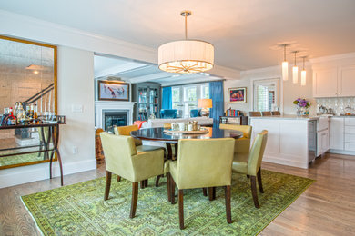 Great room - mid-sized transitional light wood floor and beige floor great room idea in Boston with white walls, a standard fireplace and a wood fireplace surround
