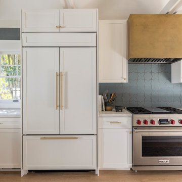 Kitchen with Built-In Panel-Ready Fridge, Wolf Range, and Floating Shelves