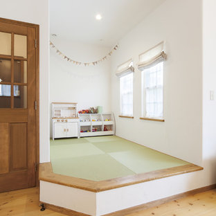 Inspiration for a mediterranean open plan living room in Other with white walls and tatami flooring.