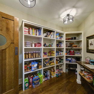 Kitchen pantry designs - Kitchen pantry - u-shaped dark wood floor kitchen pantry idea in Phoenix with open cabinets, beige cabinets and a peninsula
