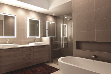 Inspiration for a mid-sized modern master beige tile and porcelain tile porcelain tile and beige floor bathroom remodel in Phoenix with flat-panel cabinets, beige cabinets, a two-piece toilet, beige walls, quartz countertops and a hinged shower door
