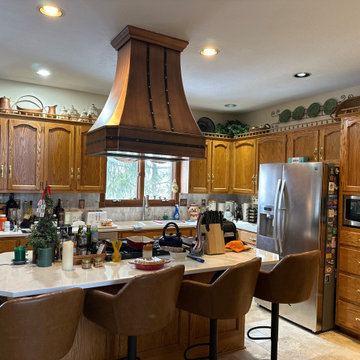 Artisan-Made Copper Island Hood with Classic Curved Silhouette