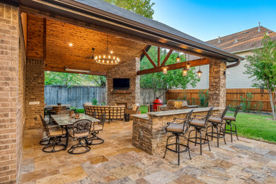 This is an example of a rustic patio in Houston.