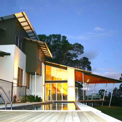 Exterior view of pool and house with Breezway louvre windows - Windows