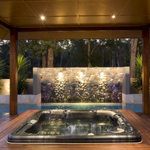 remedial portable decked spa at back of bedroom near swimming pool